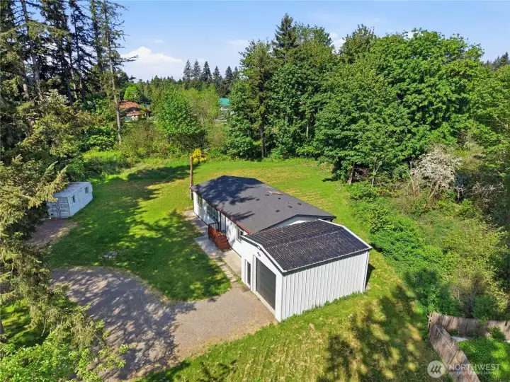 This drone shot gives you a birds eye view of the left side of the property and the Conex Box.