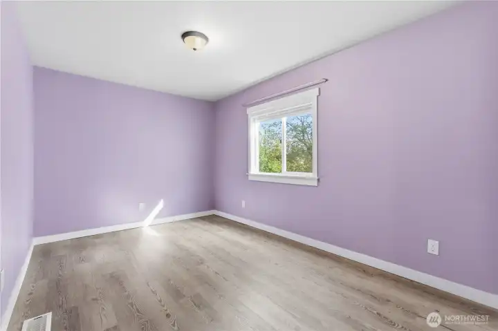 Second bedroom is located at the back of the home and again has large closets with slide doors and pretty view of the yard.