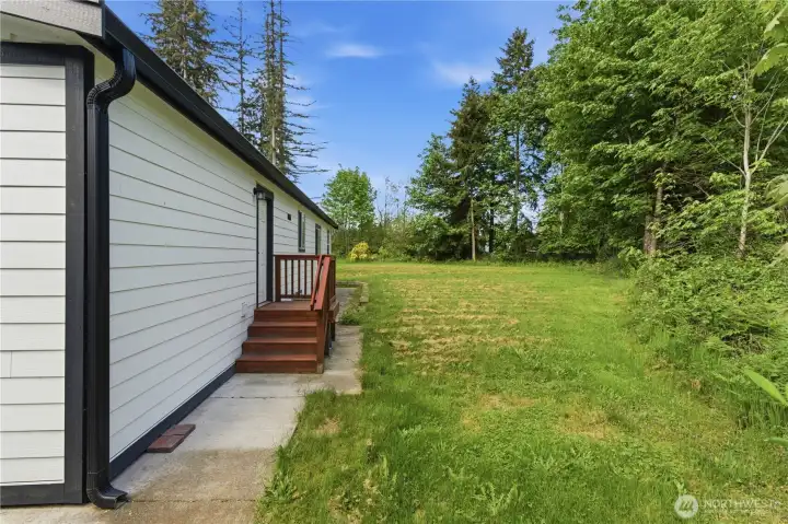 Back entry to home.  Imagine a large deck that wraps around the back end of the home!!