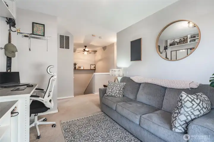 Additional loft with custom desk and shelving that can stay with home