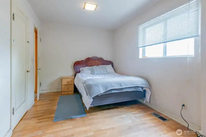 Primary Bedroom with original hardwood floors Primary Bedroom with original hardwood floors
