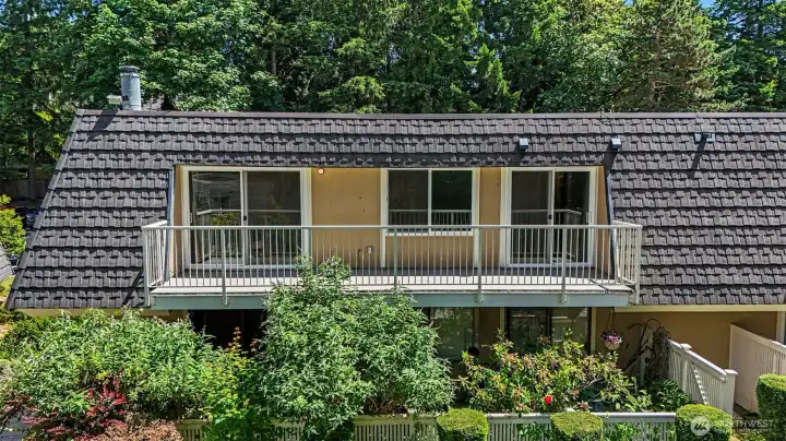 Condo balcony that overlooks the pool and greenbelt
