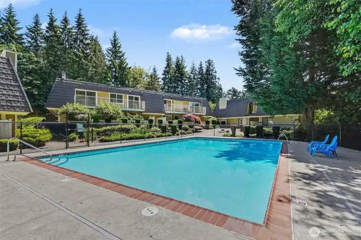 Condo up to the left of fully fenced pool