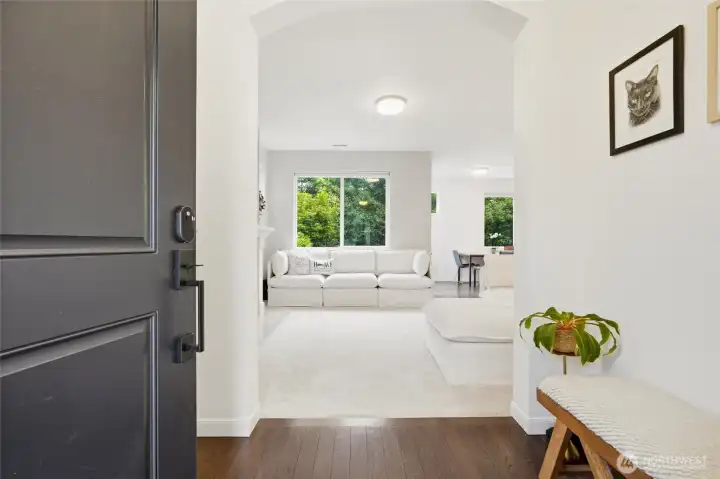 The welcoming foyer draws you into the heart of the home, where high ceilings and abundant natural light create an airy feel. The welcoming foyer draws you into the heart of the home, where high ceilings and abundant natural light create an airy feel.