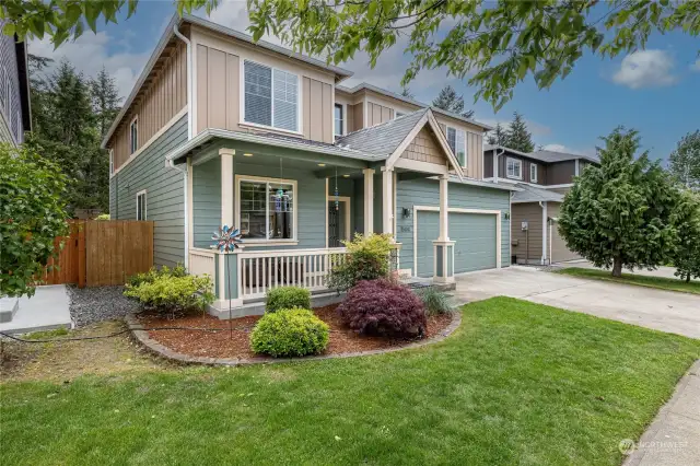 Professionally landscaped yard frames this beautiful home in the sought-after Freestone Station neighborhood.