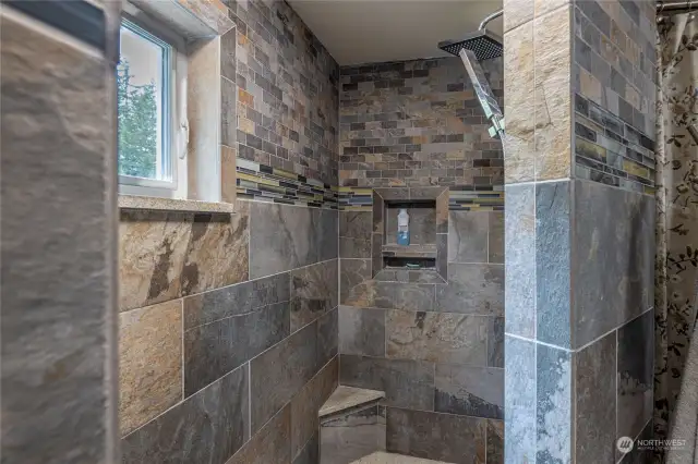The large walk-in shower makes cleaning easy; NO GLASS that gets hard water stains or rust residue.