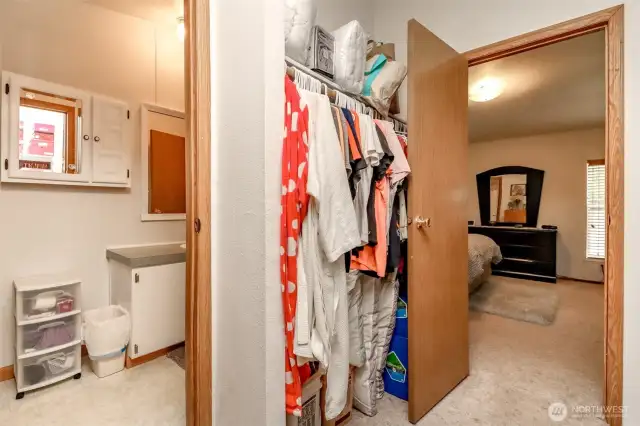 Primary walk in closet w/entrance to bathroom