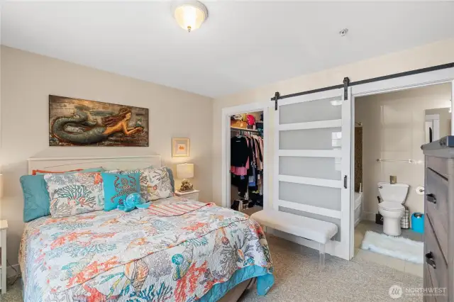 Bedroom with sliding door to full bath