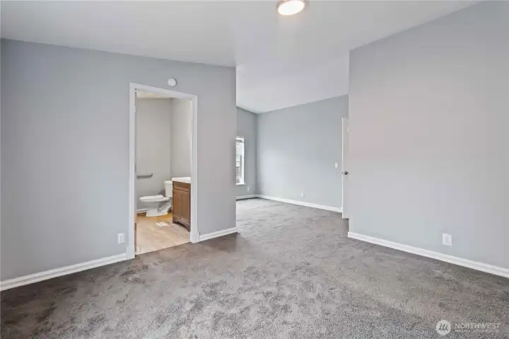 Main bedroom looking toward bathroom on the left and sitting area straight ahead