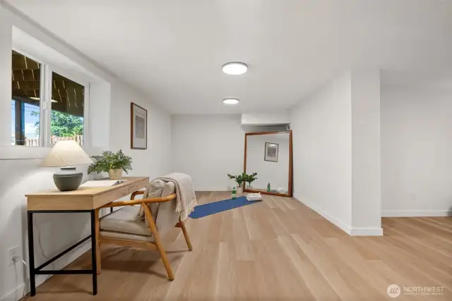 The flexible layout suits your lifestyle—perfect for a home office or creative space—while a new window brings natural light into the basement, making it feel bright and inviting.