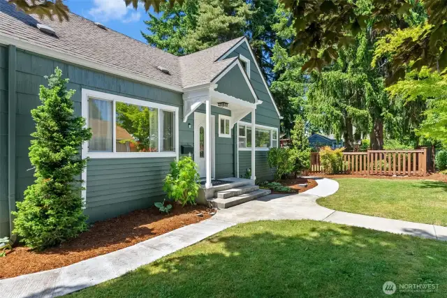 A fresh painted fence and garden bark showcase the beauty of both the home and the lot.