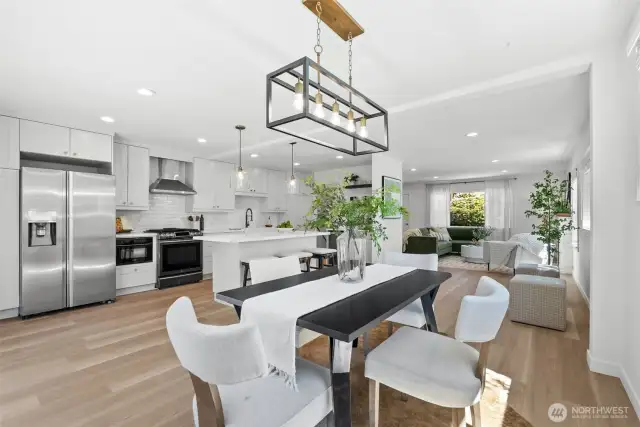 The elegant dining room opens to both the kitchen and the covered outdoor deck, making entertaining effortless.