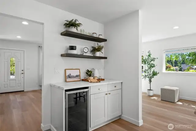 Enjoy a built-in wine fridge and bar area—perfect for casual gatherings or special occasions.