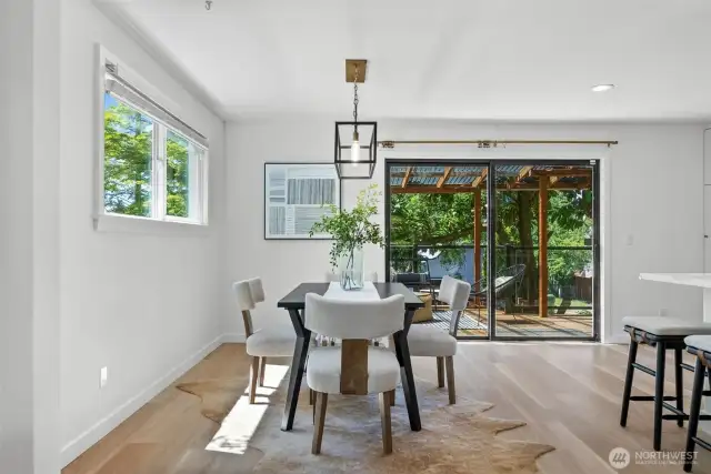 The dining space is conveniently located off the kitchen with overflow seating at the island for those bustling holiday get togethers.