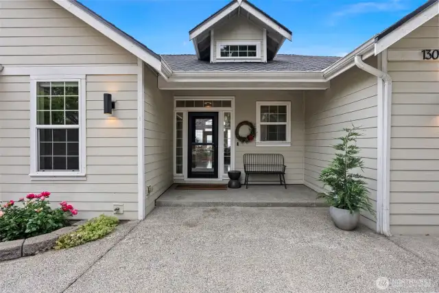Private patio leads to the elegant front door