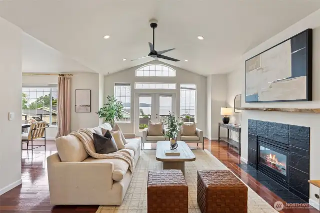 Walk straight and you'll immediately find brazilian cherry hardwoods leading to the expansive living room