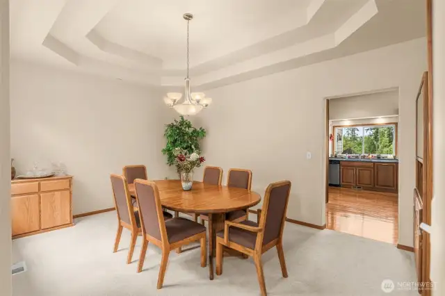 Formal dining room with coffered ceiling.