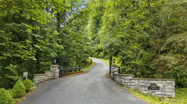 A gated entrance and paved drive lead you to a secluded oasis.