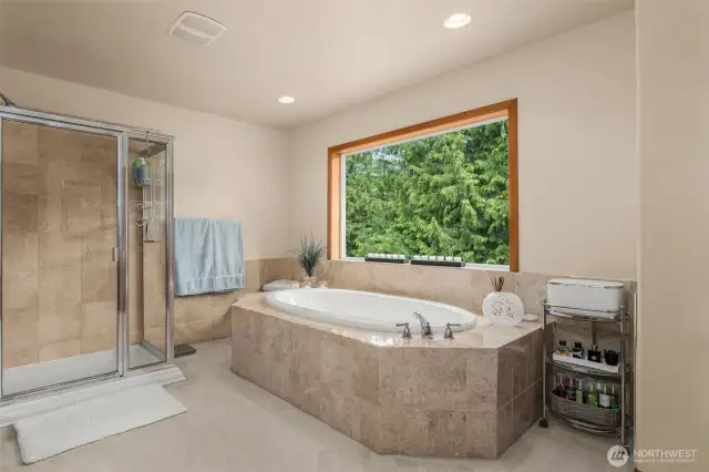 Soak up paradise from the expansive primary suite’s soaking tub.