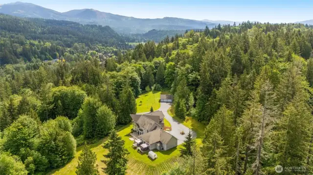 This gorgeous property is nestled on a hilltop amongst privacy & tranquility, yet, it's minutes from Bellevue, Downtown Seattle, and SeaTac airport.