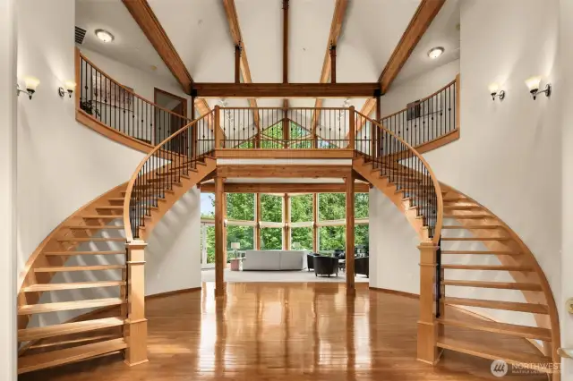 An impressive foyer with double staircase and soaring ceilings welcomes you home.