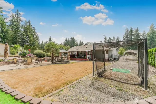 Room for RV parking, golf driving cage included