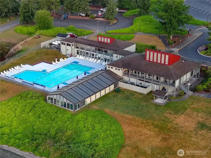 The Beach Club boasts two pools: one indoor and one outdoor. The grassy park area below stretches to the beach.