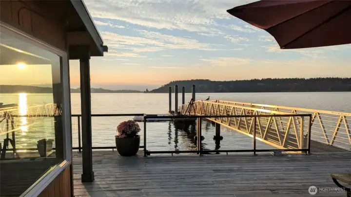 Waterfront living at its rarest, two homes and a commercial strength dock built directly over the Puget Sound at Titlow Beach