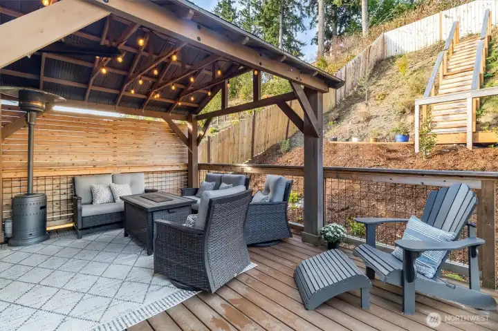 Covered, spacious deck with privacy wall