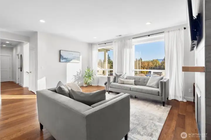 From living room down hallway to entrance, office, powder room, primary suite and laundry