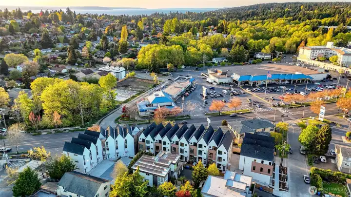 Steps from everything — from grocery stores to local dining, this aerial shot shows just how close your new home is to daily essentials.