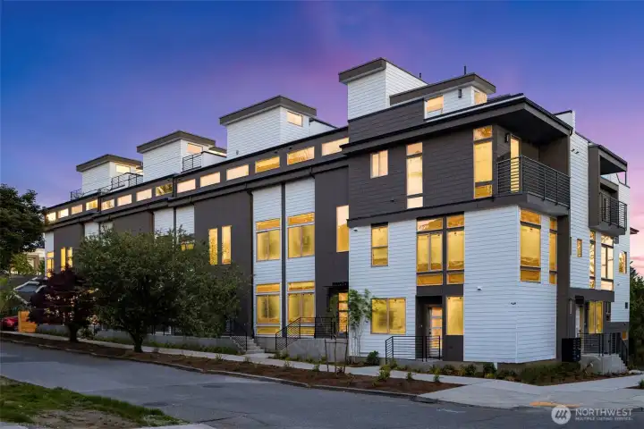 A fresh, contemporary exterior enhanced by thoughtful detailing and warm evening glow is designer living, inside and out.