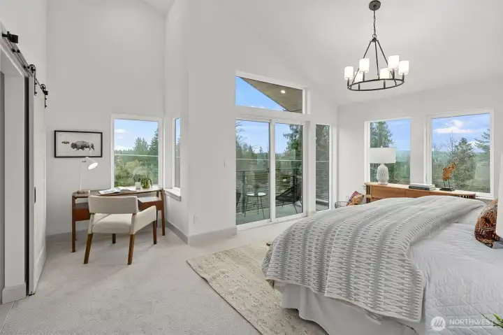 Primary Bedroom on 3rd floor with view balcony.