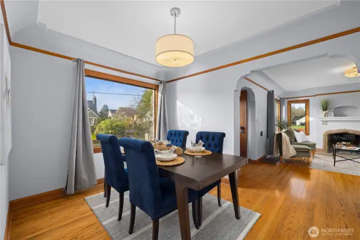 Formal dining room connects the living room to the kitchen.
