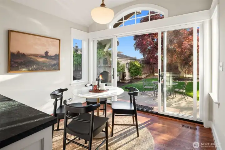Breakfast nook highlighted by an antique milk glass pendant originally from Portland’s historic Drake Hotel