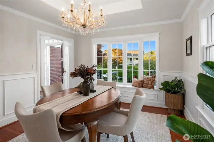 Formal dining room featuring a 1930s-era crystal chandelier by Massive