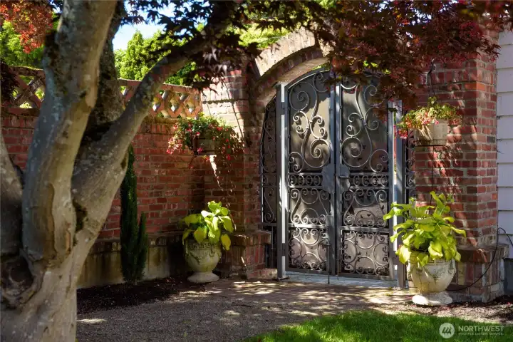 Peace of mind with three beautiful custom wrought iron gates on property.