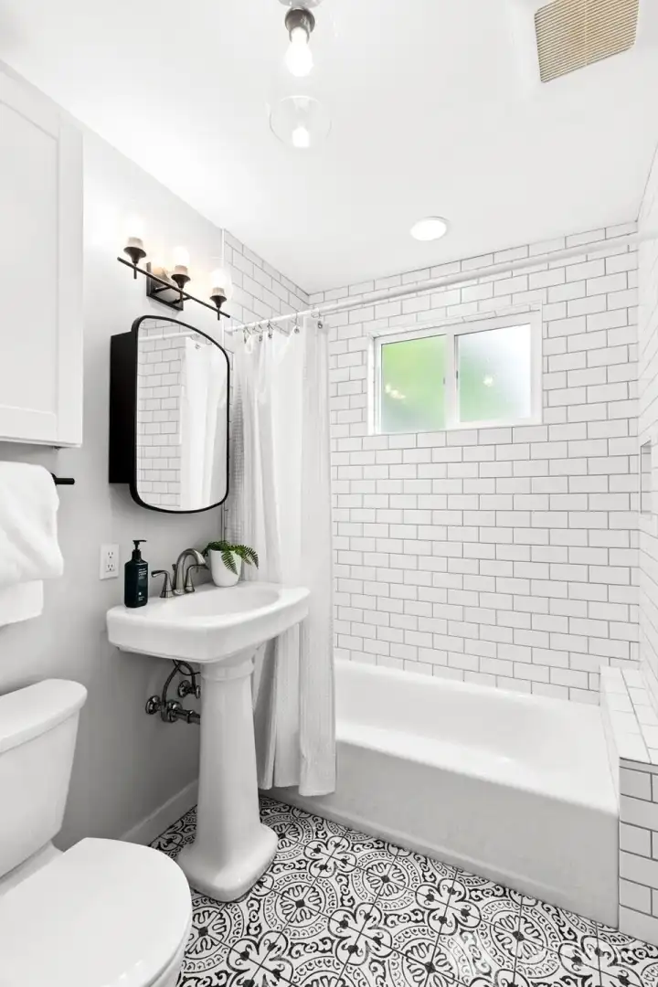 Remodeled main bathroom with statement tile