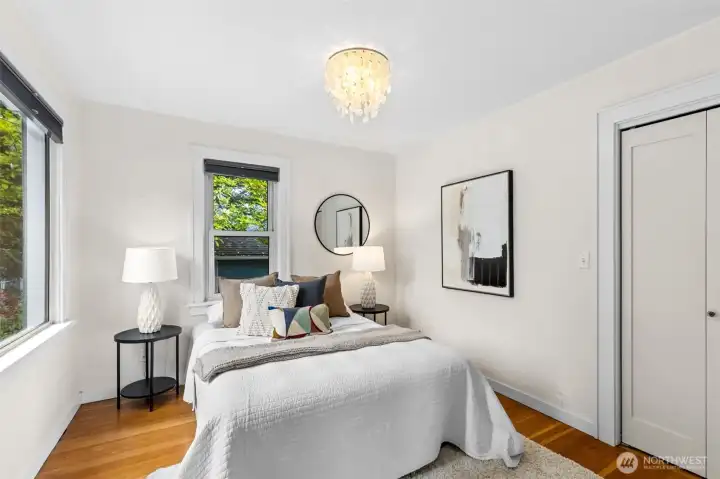 Bedroom #2 with large picture window and fir floors
