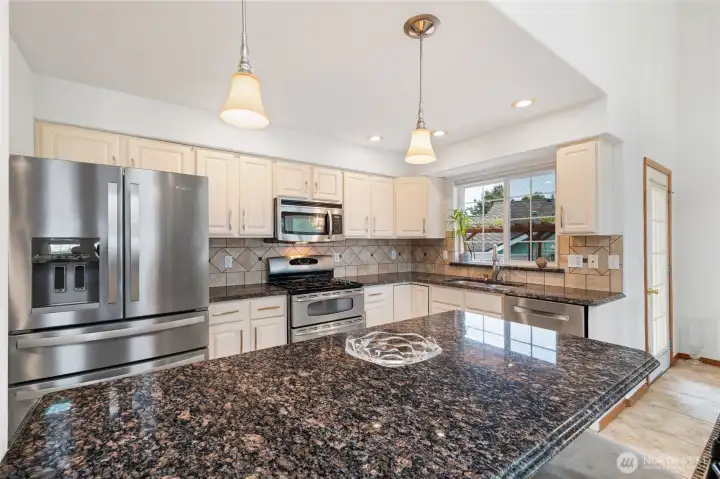 Looking into the kitchen. The large island/breakfast area.