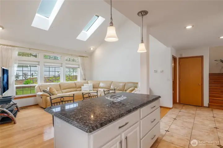 "Open Concept" with over-height windows light the room beautifully.