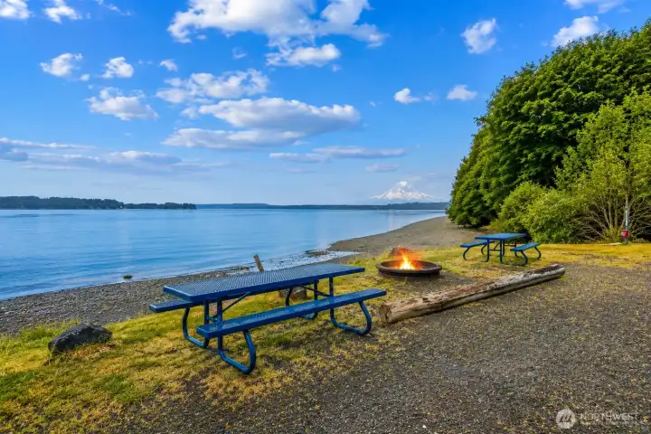 End your day with a beach fire, saltwater views, and Mt. Rainier on the horizon.