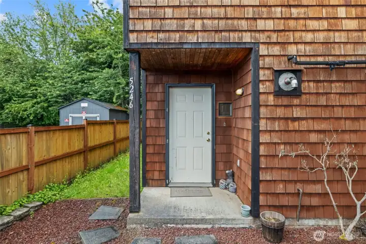 Character starts at the front door.    Warm cedar siding and a practical covered entry create a welcoming arrival while blending seamlessly into the natural surroundings.