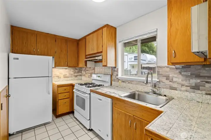 Compact, practical, and full of potential—the perfect space to create your own coastal cottage kitchen vision.