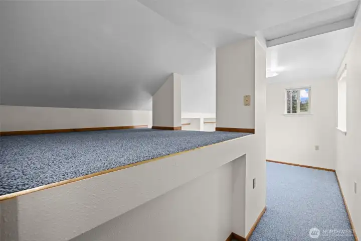 Additional loft space provides room for storage, hobbies, seasonal décor, and more.