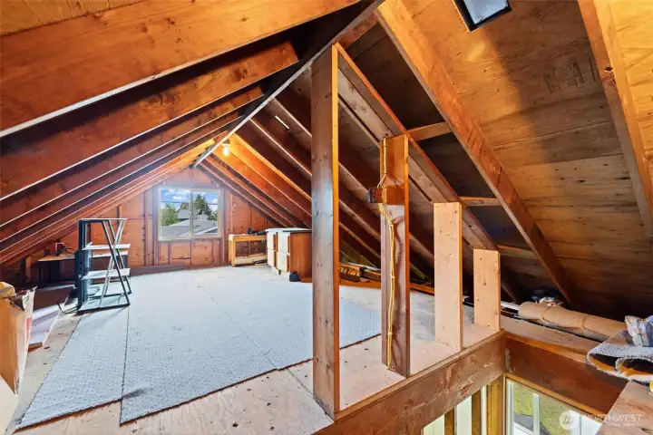 Rustic beams, soaring ceilings, and endless possibilities. A unique bonus space waiting for its next chapter.