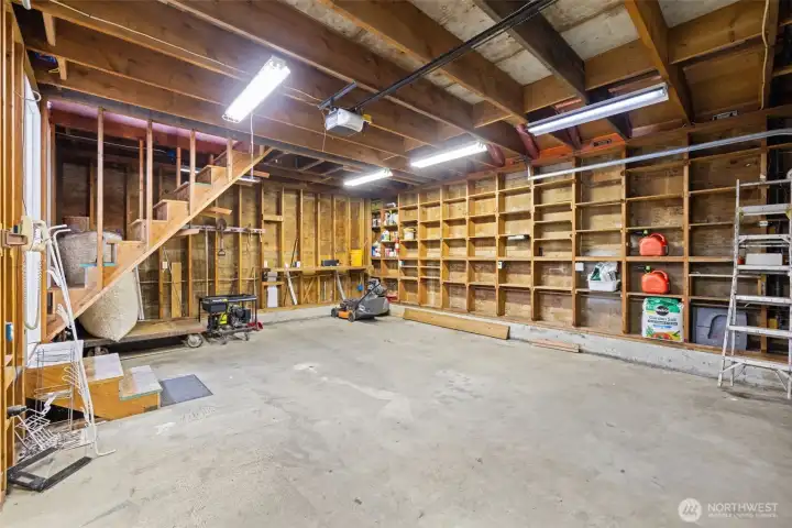 Floor-to-ceiling built-in shelving creates exceptional storage for tools, supplies, seasonal décor, and outdoor gear.