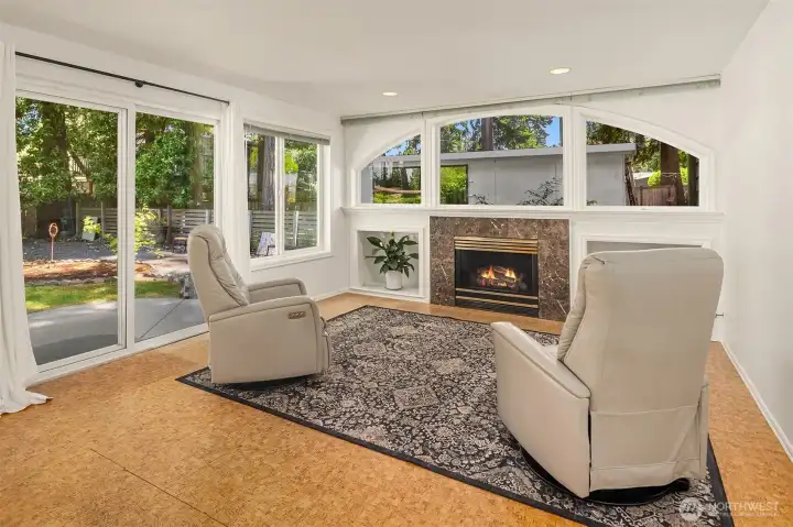 Family Room with Big Windows, and cozy Gas Fireplace