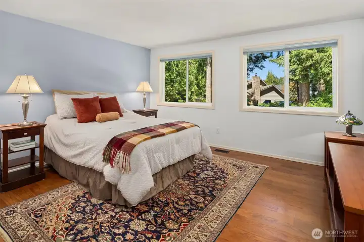 Primary Ensuite with French Doors and View of the Gardens