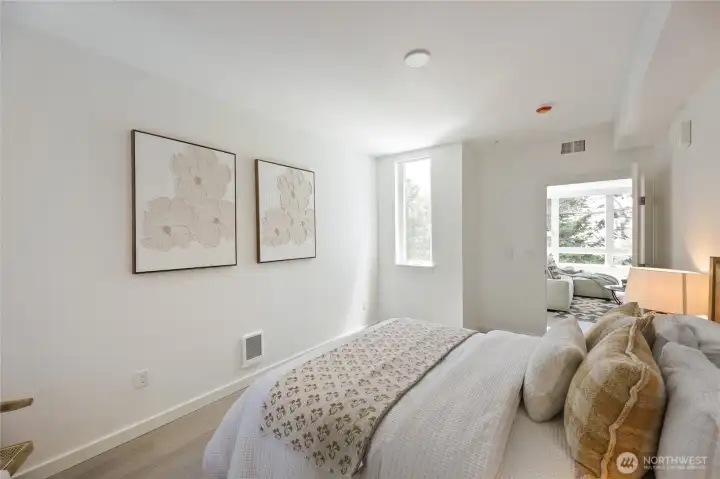 Lots of natural light and the LVP flooring carried through the bedroom